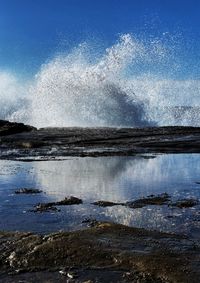 Sea waves splashing on rocks