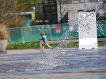 Boy playing in water