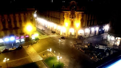 High angle view of city lit up at night