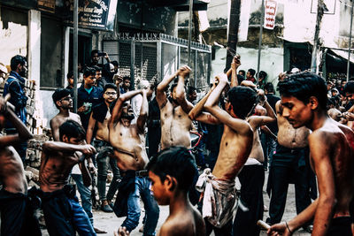 Group of people at street in city