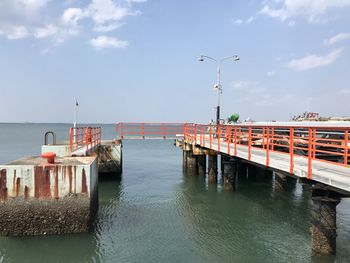 Pier over sea against sky