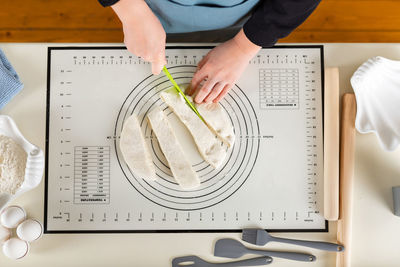 Midsection of man working on table