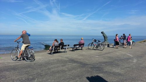 People riding bicycles on beach