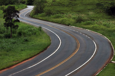 Road passing through a field