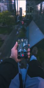 Midsection of woman using mobile phone