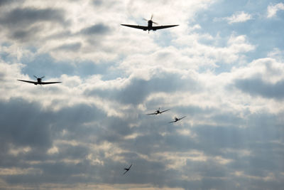 Low angle view of airplane flying in sky