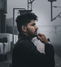 Portrait of young man looking away