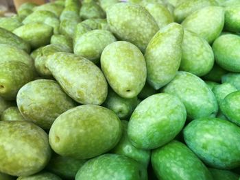 Full frame shot of green olives for sale at market stall