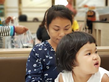 Mother sitting with daughter