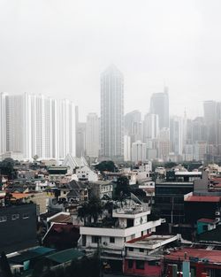 Modern buildings in city against sky