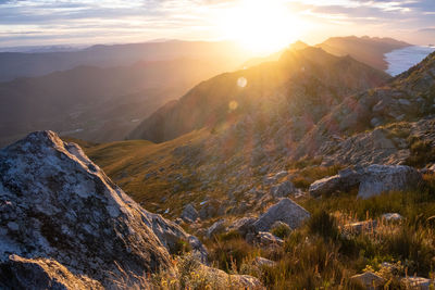 Scenic view of mountains against sky during sunset