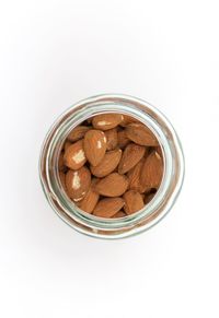 High angle view of food in jar against white background