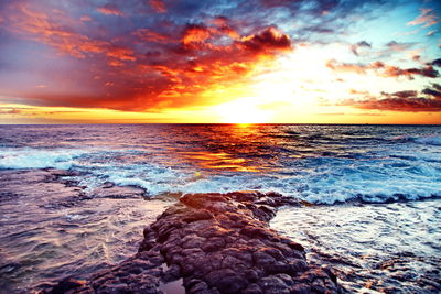 Scenic view of sea against sky during sunset