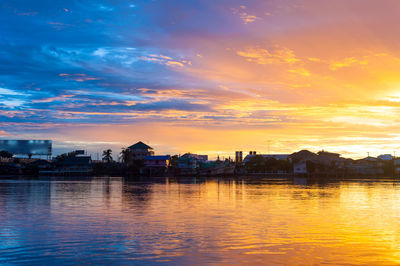 Scenic view of river against romantic sky at sunset