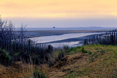 Scenic view of sea against sky during sunset