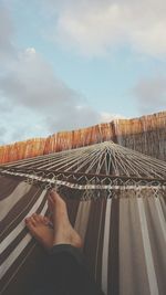 Low section of woman against clear sky