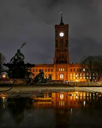 Reflection of illuminated buildings in city at night