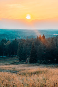 Scenic view of landscape against sky during sunset