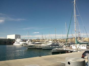 Boats moored at harbor