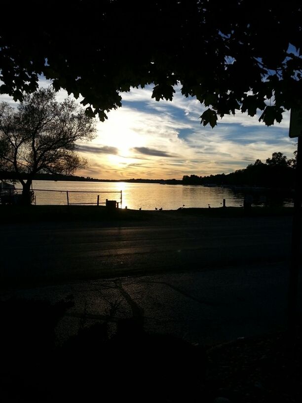 sunset, tree, silhouette, sky, tranquility, tranquil scene, scenics, beauty in nature, nature, water, cloud - sky, landscape, idyllic, sunlight, no people, bare tree, outdoors, lake, cloud, river