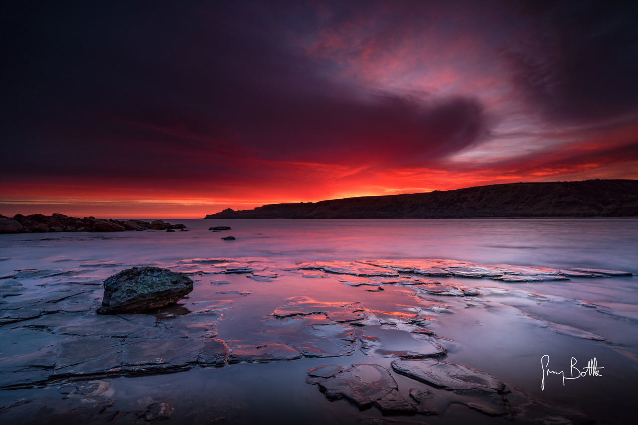 sunset, beauty in nature, scenics, nature, sky, tranquility, tranquil scene, sea, water, no people, outdoors, cloud - sky, idyllic, mountain, horizon over water, day