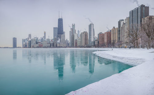 Modern buildings in city against sky