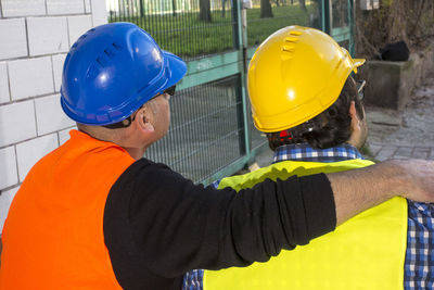 Midsection of man working with umbrella