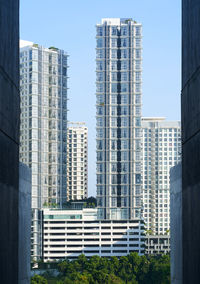 Modern buildings in city against clear sky