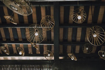 Low angle view of electric fan hanging from ceiling