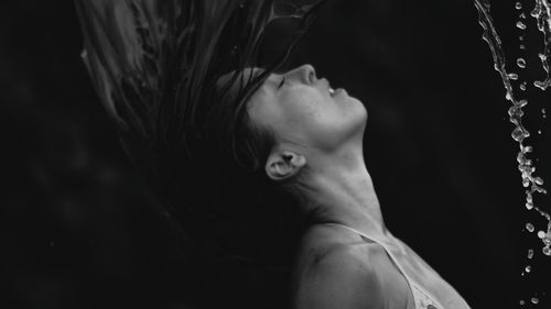 Close-up of woman flipping hair