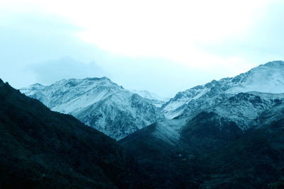 Scenic view of mountains against sky during winter