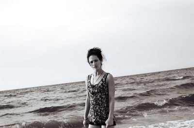 Portrait of man on beach against sky