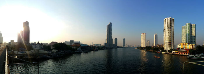 Panoramic view of modern buildings in city against sky