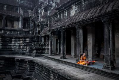 People outside temple in historic building