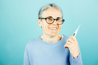 Portrait of young woman using mobile phone