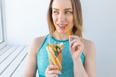 Portrait of woman eating food