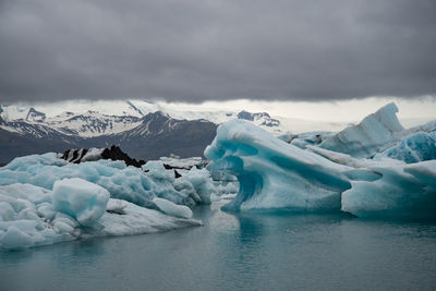 Scenic view of frozen lake against sky