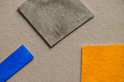 High angle view of various papers on cardboard