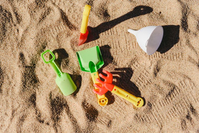 High angle view of toys on beach