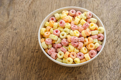 High angle view of chopped fruits in bowl on table