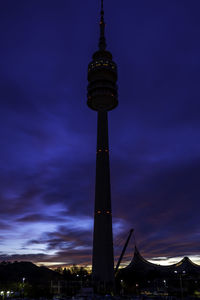 Low angle view of illuminated building against sky at night