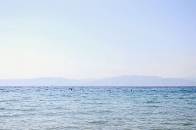 Scenic view of sea with mountains in background