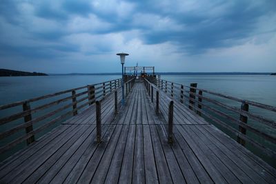 Pier over sea against sky