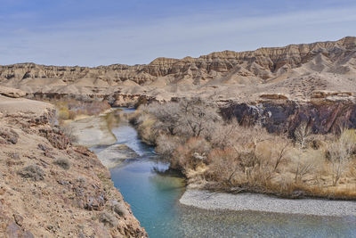 Charyn river going along yellow canyon, part of charyn canyon, national natural park in kazakhstan