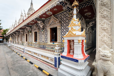 Statue of temple against building