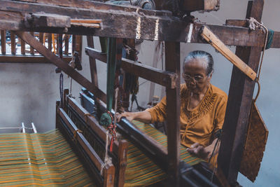 Man working on metal grate