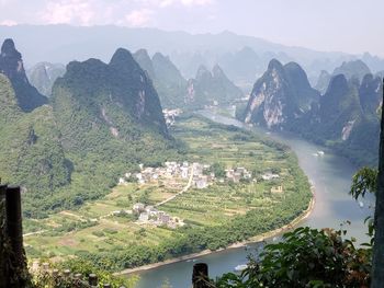 High angle view of trees and mountains against sky