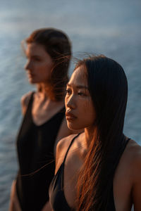 Side view of young woman looking away