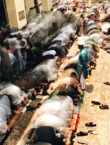 HIGH ANGLE VIEW OF PEOPLE ON STREET