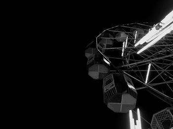 Low angle view of illuminated ferris wheel